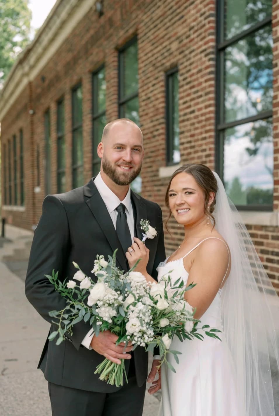 Happy couple with bridal bouquet